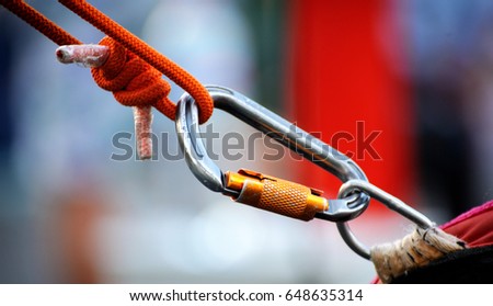 Climbing sports image of a carabiner on a rope 