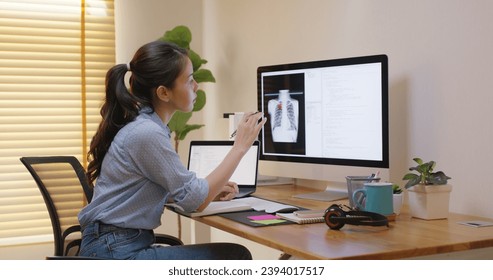 Clinical coder programmer improve future patient care service. Medtech big data tool developer automatic IT software lung X-ray covid analyze cloud computing typing python check code at home office. - Powered by Shutterstock