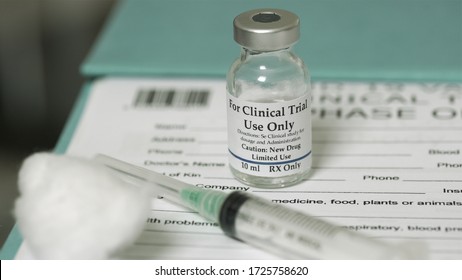 Clinical trial medicine, for the covid-19 coronavirus, on clipboard
