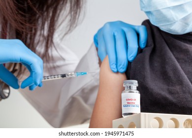 Clinical Trials Are Ongoing For The Safety And Efficacy Of COVID 19 Vaccinations Among Children. A Concept Image Showing A Child Getting COVID Vaccine Through Intramuscular Injection.