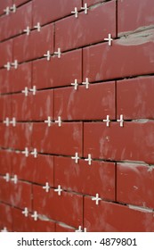 Clinker Tiles Arranging To Wall With Pegs.