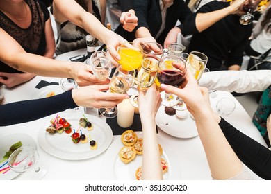 Clinking glasses with alcohol and toasting, party. Congratulations to the event. Cheerful party friends - Powered by Shutterstock