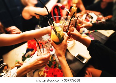 Clinking Glasses With Alcohol And Toasting, Party. Congratulations To The Event. Cheerful Party Friends