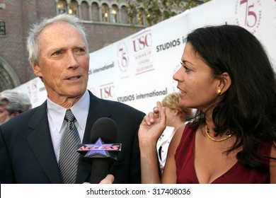 Clint Eastwood And Dina Ruiz At The 75th Diamond Jubilee Celebration For The USC School Of Cinema-Television Held At The USC's Bovard Auditorium In Los Angeles, USA On September 26, 2004.