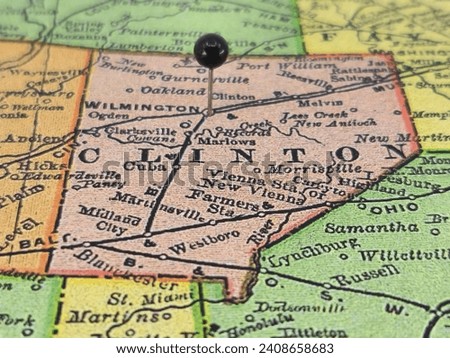 Clinton County, Ohio marked by a black tack on a colorful vintage map. The county seat is located in the city of Wilmington, OH.