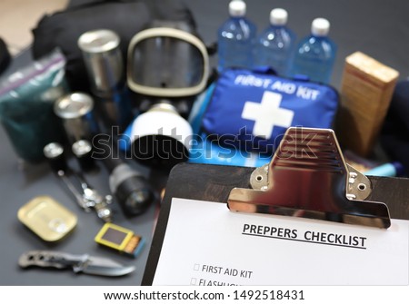 Clipboard checklist.Preppers are know for preparing for natural disasters,economic collapse,civil unrest or any doomsday scenario Such items would include food,water,lighting,shelter,and first aid kit