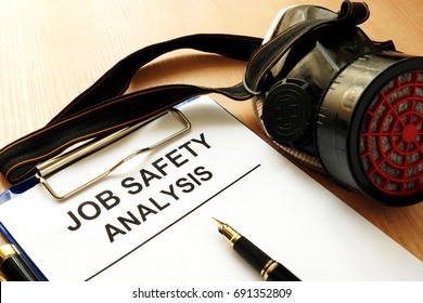 Clipboard With Document Job Safety Analysis.