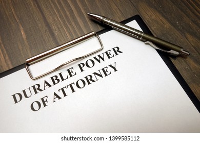 Clipboard With Durable Power Of Attorney And Pen On Wooden Desk Background