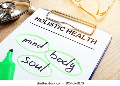 Clipboard With Holistic Health And Words Mind, Body And Soul.