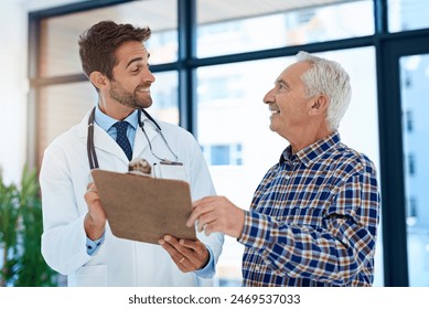 Clipboard, hospital or medical with doctor and old man in office for consulting appointment. Healthcare, insurance or trust with senior patient and medicine professional in clinic for medicare - Powered by Shutterstock