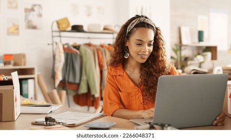 Clipboard, laptop and black woman writing in clothing store working on sales or delivery. Fashion, manager and worker in South Africa in small business, fashion shop and planning schedule on computer - Shutterstock ID 2266048371