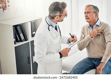 Clipboard, man and doctor in office with shoulder pain, checkup and health advice at senior clinic. Diagnosis, elderly patient and medical professional with support, muscle injury and consultation - Powered by Shutterstock