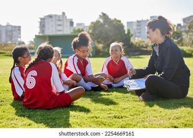 Clipboard, soccer or coach with children planning for strategy, training or sports goal in Canada. Team building, friends and woman coaching group of girl on football field for game, match or workout - Powered by Shutterstock