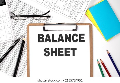 Clipboard With Text BALANCE SHEET And Keyboard And Chart On White Background.