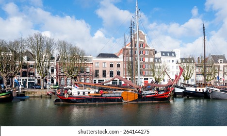 The Clipper In The Foreground Was Built In 1891 As A Sailing Cargo Ship. Now You Can Step Aboard And Enjoy A Holiday On The Water. On The Background Canal Houses In The Dutch City Of Dordrecht.