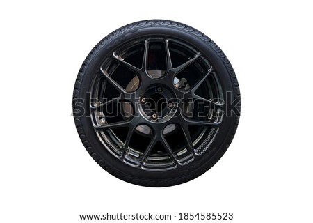 Clipping path. Black Wheel super car isolated on white background view. Magneto wheels. Movement. Wheel super car.