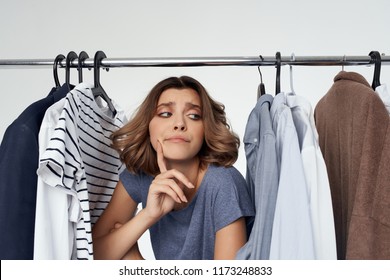 Cloakroom Attendant At The Counter With Clothes                      