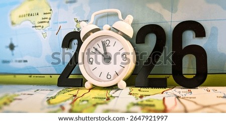 Clock and 2026 Numbers on a World Map Representing Time, Travel, and Global Planning