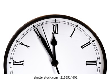 Clock about to strike midnight isolated on white background - Shutterstock ID 2186514601