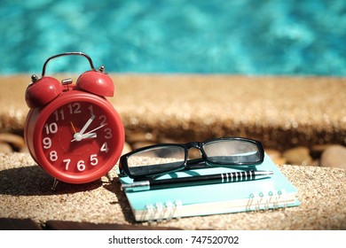 clock and book and glasses