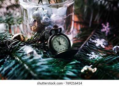 Clock with a chain in the tree.
