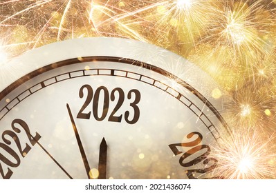 Clock counting last moments to New 2023 Year and beautiful fireworks on background  - Shutterstock ID 2021436074