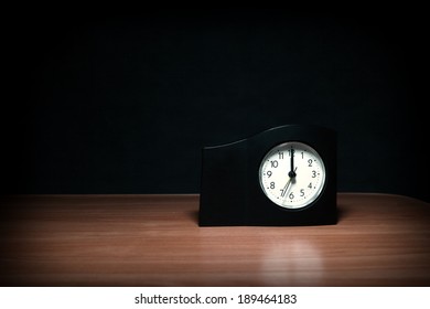 Clock in the Dark Room with display Almost Midnight - Powered by Shutterstock