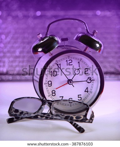 Clock and eyeglass