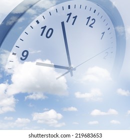 Clock face in blue sky - Shutterstock ID 219683653