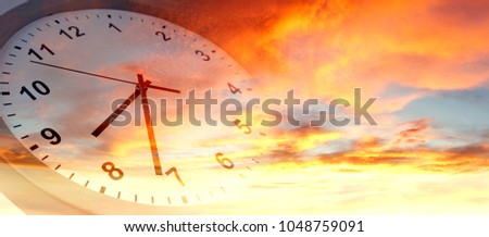Clock face in bright sky. Time passing