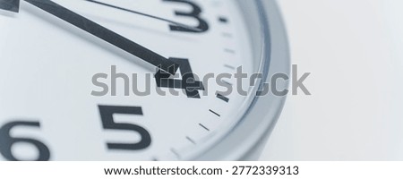 Clock face displaying numbers and hands. Concept of time passing, urgency, and punctuality for work, school, or event