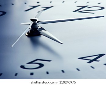 Clock face with focus on center. Time concept.