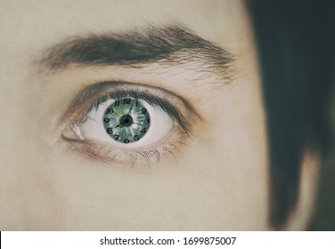 Clock face inside a human eye. Close up shot, shallow depth of field. Time concept