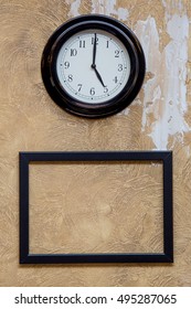 clock and frame on the wall