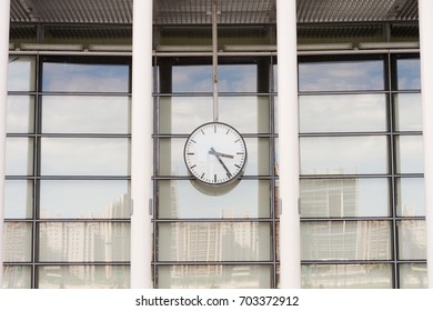 Clock in front of an office building