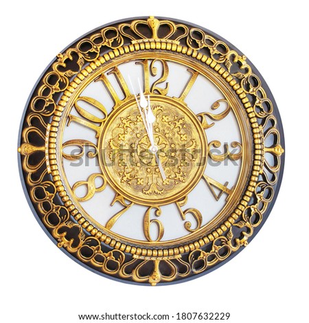 Clock with gold decoration on a white isolated background shows the approach of the New Year