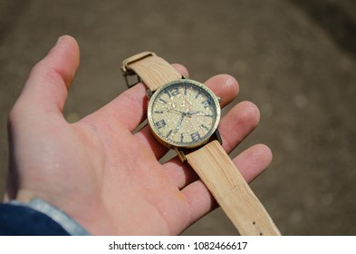 Clock in the hands of guy