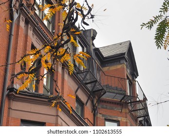 a clock hanging from the side of a building