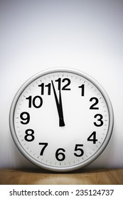 Clock hanging at the wall with copy space. 