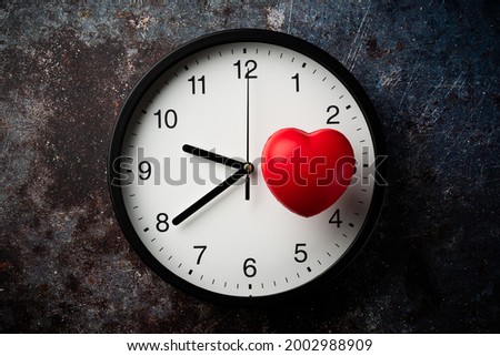 Clock and heart symbol.Image of life span.
