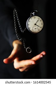 the clock is hovering over the palm