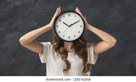 Clock Instead Of Head. Girl Hiding Over Alarm, Stress And Lack Of Time Concept