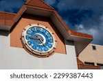 A clock with a large dial on the city tower.