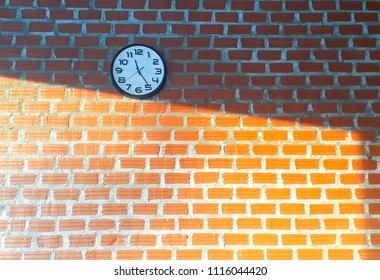 Clock, light and wall.