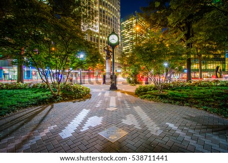 Clock and modern buildings in Uptown Charlotte, North Carolina.