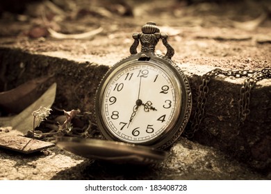 Clock on ancient brick,time concept.