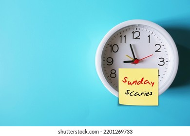 Clock On Blue Copy Space Background With Stick Note SUNDAY SCARIES (Sunday Blues) - Feelings Of Intense Anxiety Or Dread Nervousness Happen On Night Before Head Back To Work, Office Or School 