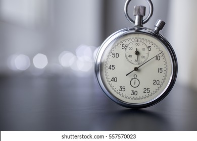Clock on a blurry background. Stopwatch in work.