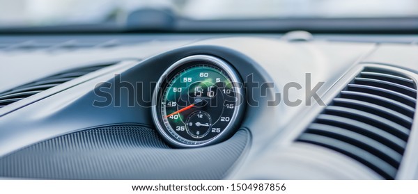 Clock on the\
dashboard of the car\
closeup