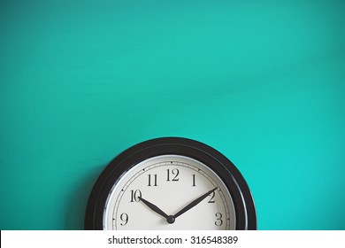 Clock on mint green wall background. Vintage effect. Concept of Time. - Shutterstock ID 316548389